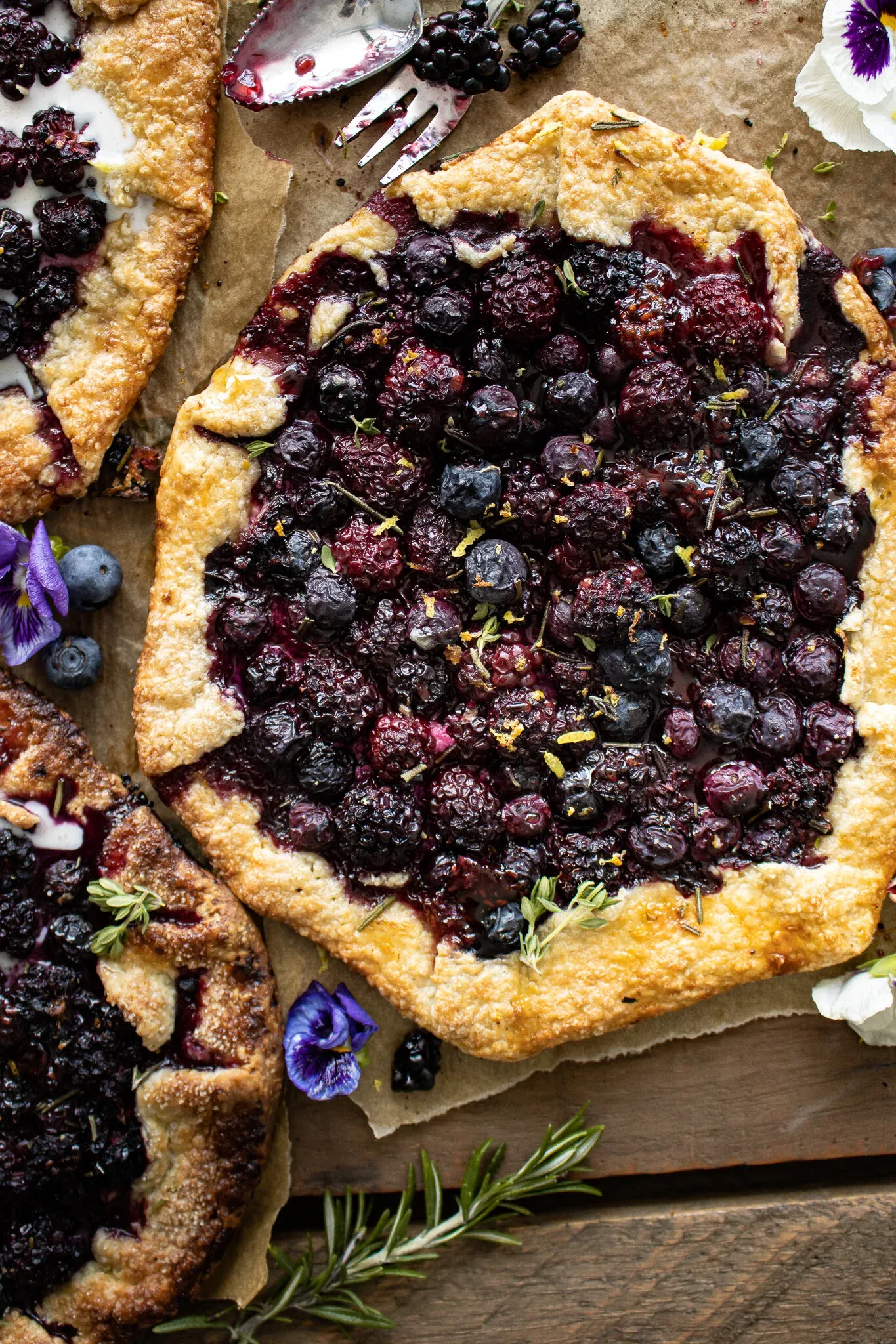 Overhead view of a freshly baked Berry Galette with juicy roasted blueberries and blackberries in the center