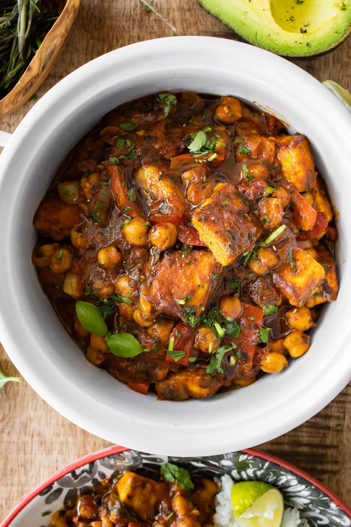 Overhead view of Vegetarian Chickpea and Paneer Picadillo served in a round white ceramic crock