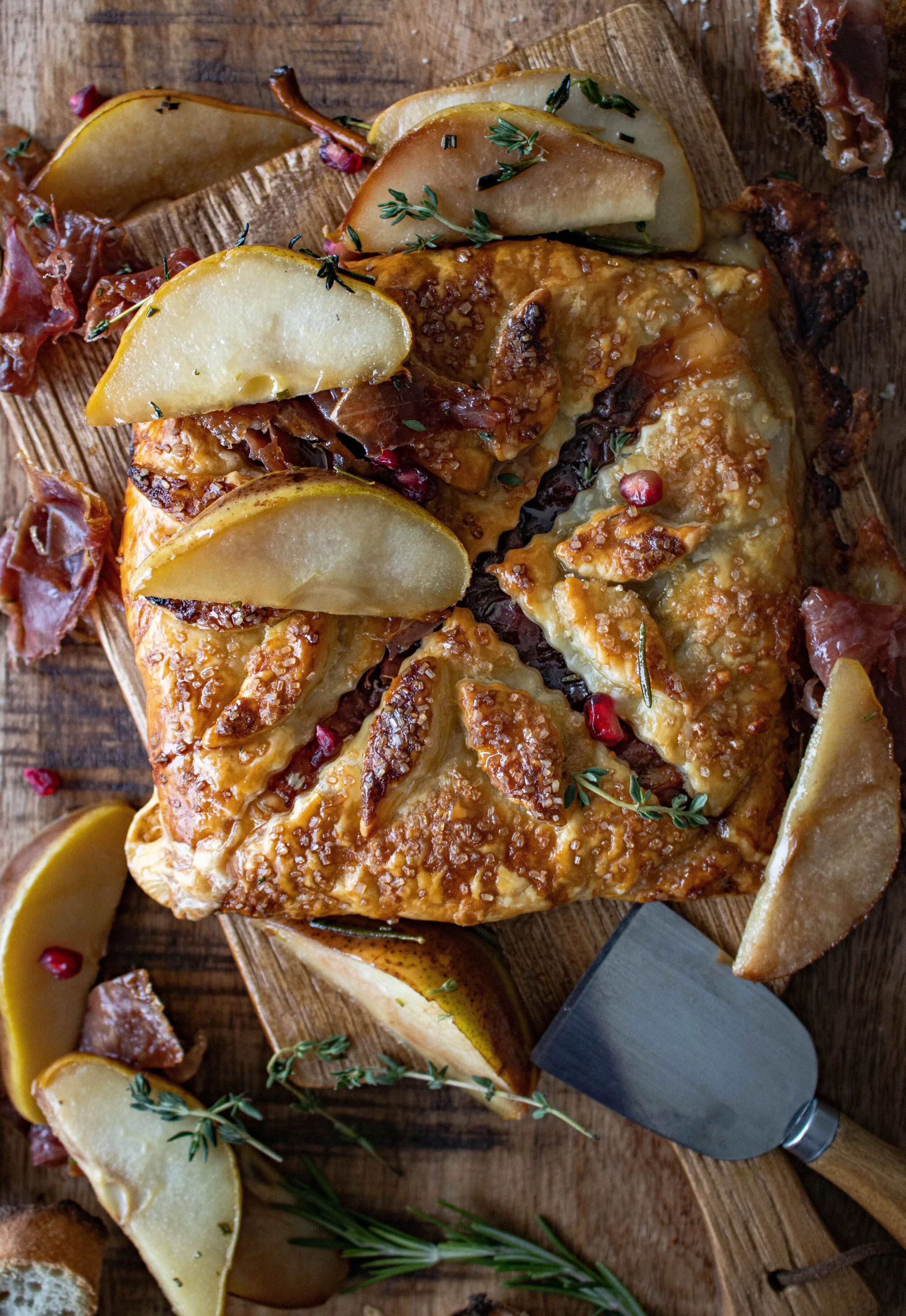 Slightly tighter overhead angle of the Wrapped Brie with Herbed Honey Peaches baked puff pastry parcel