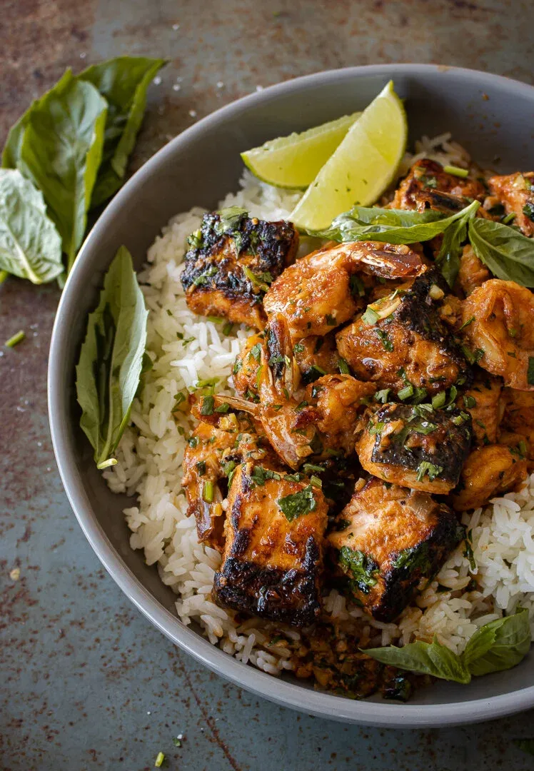Angled overhead close-up of the gray bowl of Honey Garlic Salmon and Shrimp Bowl