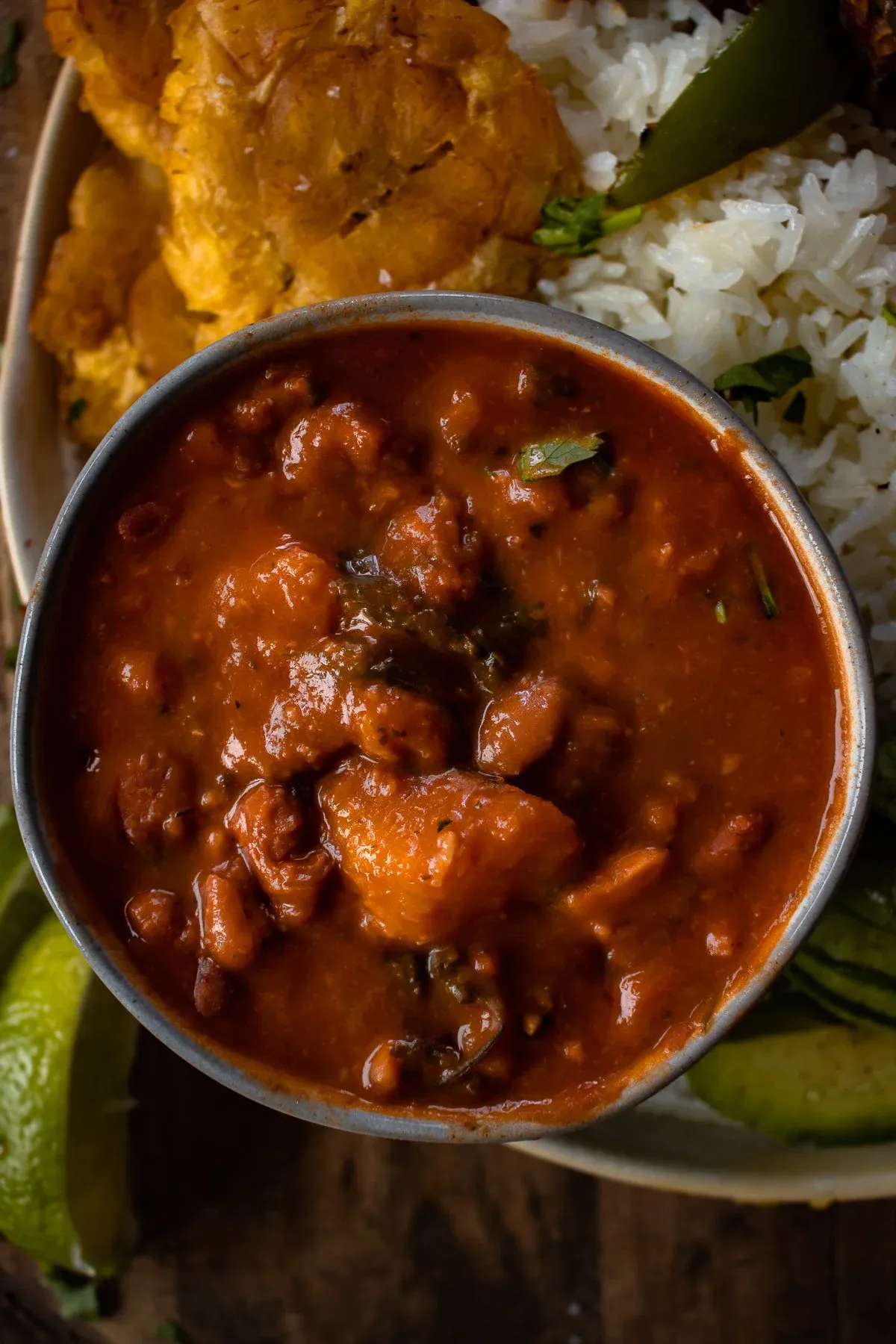 Overhead close-up of the habichuelas guisadas (Dominican stewed red kidney beans) in a small metal cup
