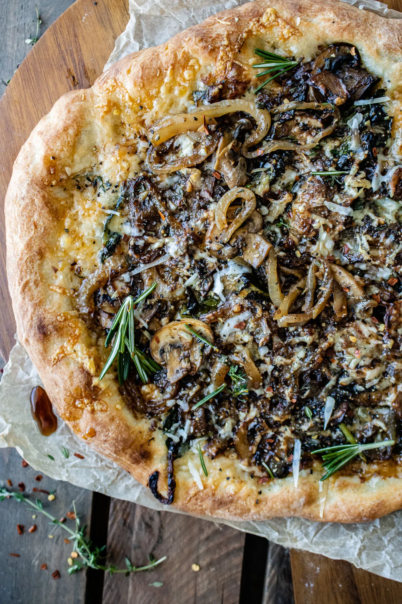 Angled close-up of a caramelized onion and mushroom pizza
