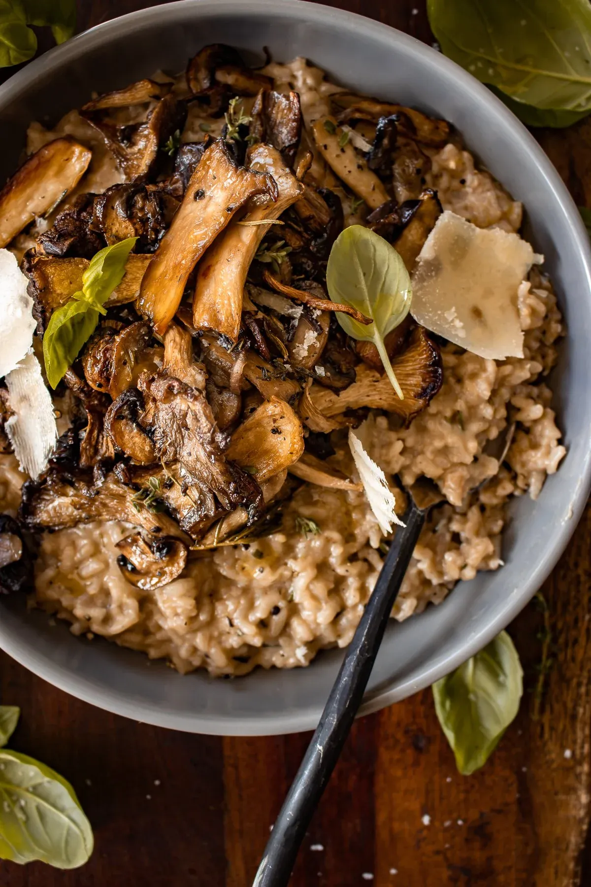 Slightly lower overhead angle of the full gray bowl of Creamy Parmesan Risotto with Roasted Thyme Mushrooms