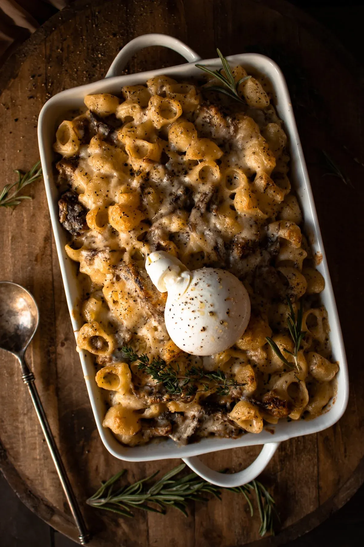 Short Rib Beecher's Mac and Cheese with Burrata served in a white rectangular ceramic baking dish with handles