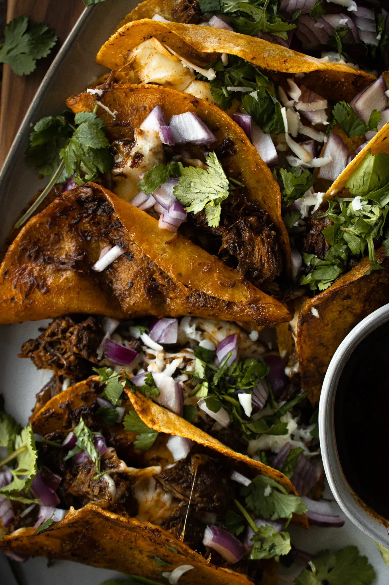 Close overhead shot of Not Birria Beef Tacos piled on a metal baking tray