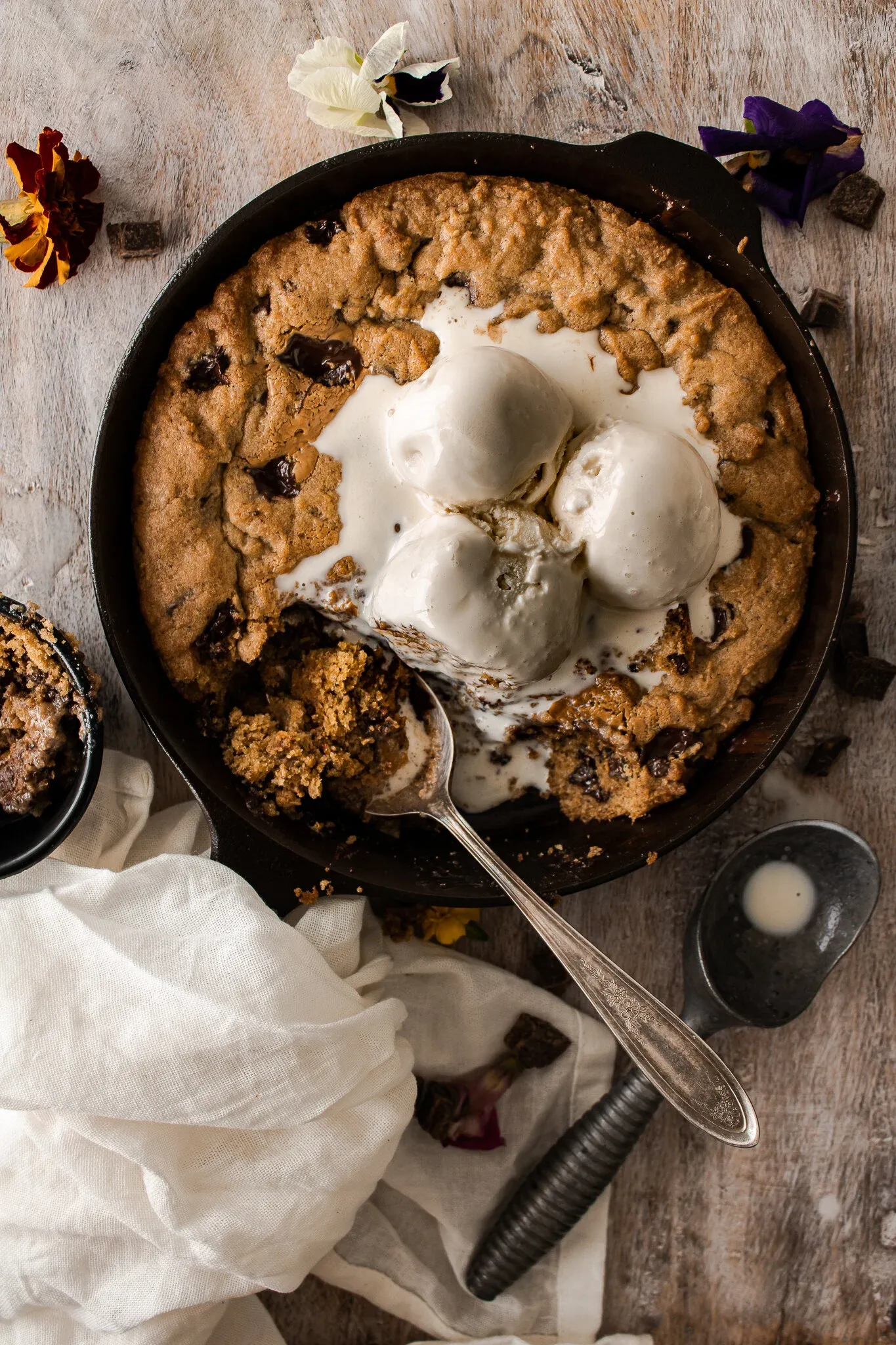 Skillet Dark Chocolate Chip Espresso Cookie baked golden-brown in a black cast iron skillet