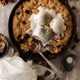 Skillet Dark Chocolate Chip Espresso Cookie baked golden-brown in a black cast iron skillet