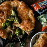 Overhead shot of Roasted Broccoli and Chicken Pot Pie with Garlic Butter Crust in a black cast iron skillet