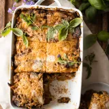 Pastelón (Plantain Lasagna) in a white rectangular ceramic baking dish with handles