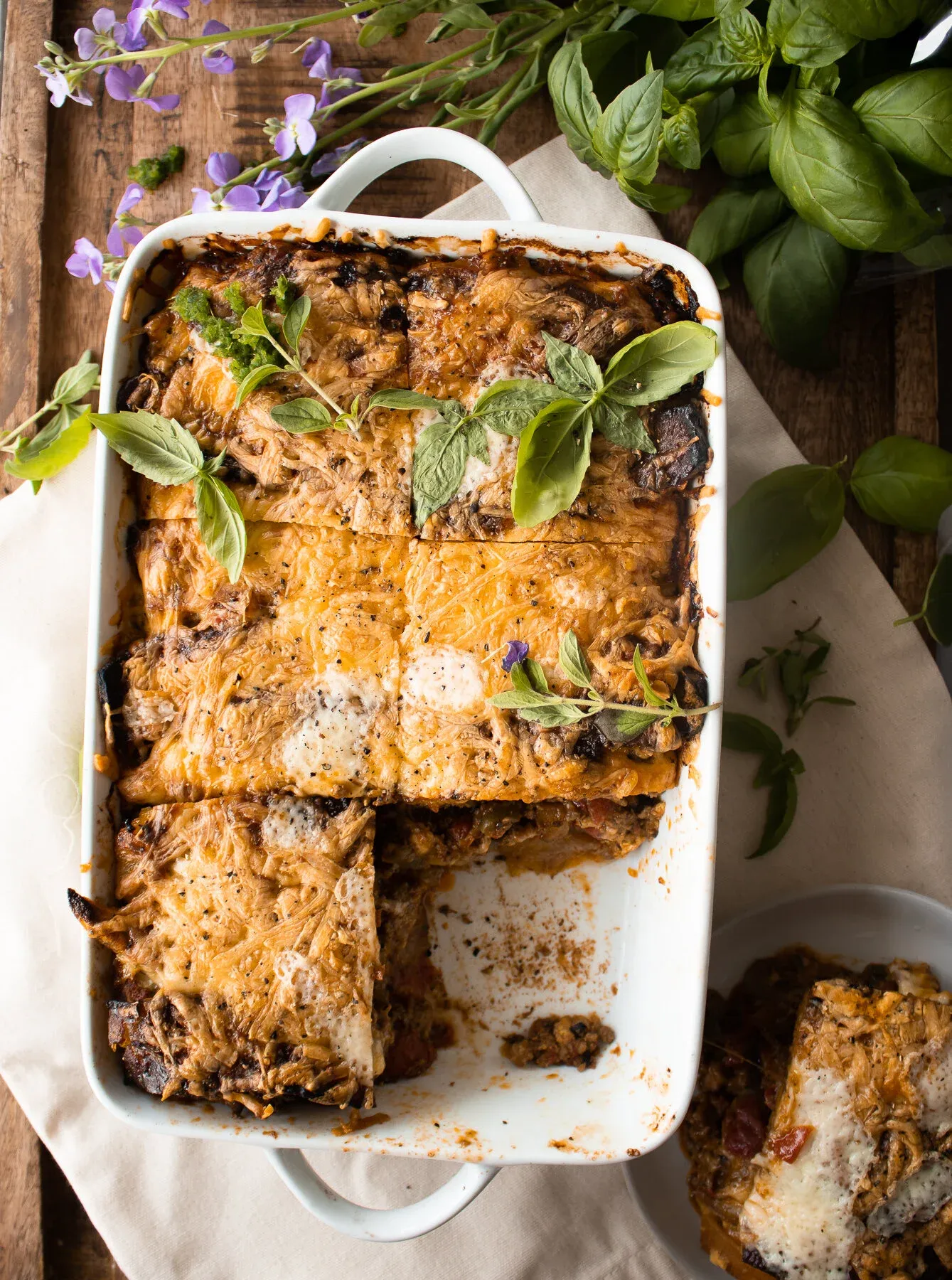 Pastelón (Plantain Lasagna) in a white rectangular ceramic baking dish with handles
