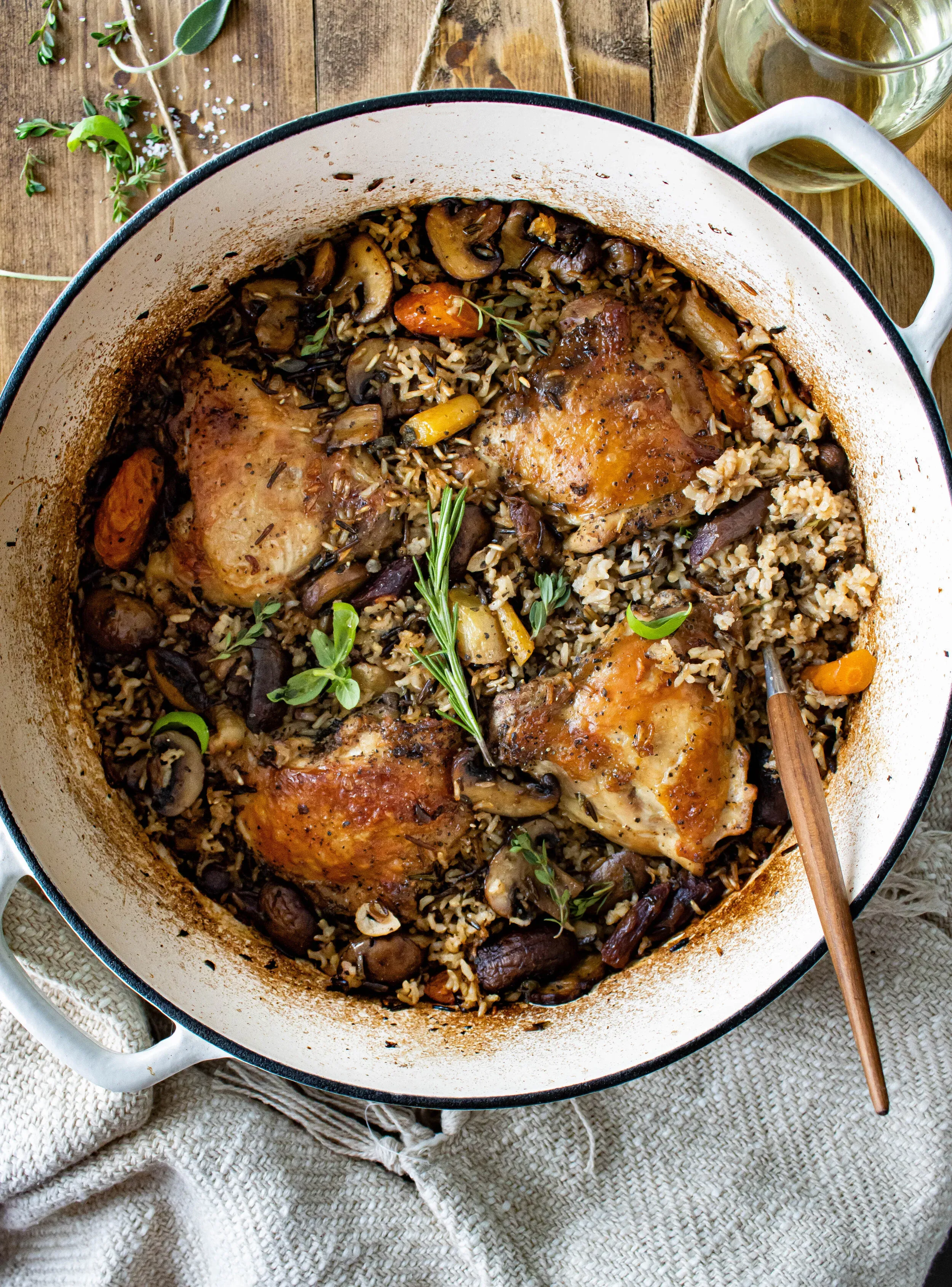 Overhead view of One Pot Wild Rice Chicken and Veggie Pilaf in a large white enamel Dutch oven