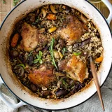 Overhead view of One Pot Wild Rice Chicken and Veggie Pilaf in a large white enamel Dutch oven